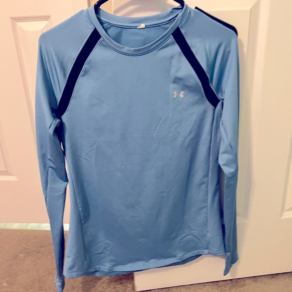 Blue Under Armour Exercise Top.Black stripes on shoulders. Soft inner lining.